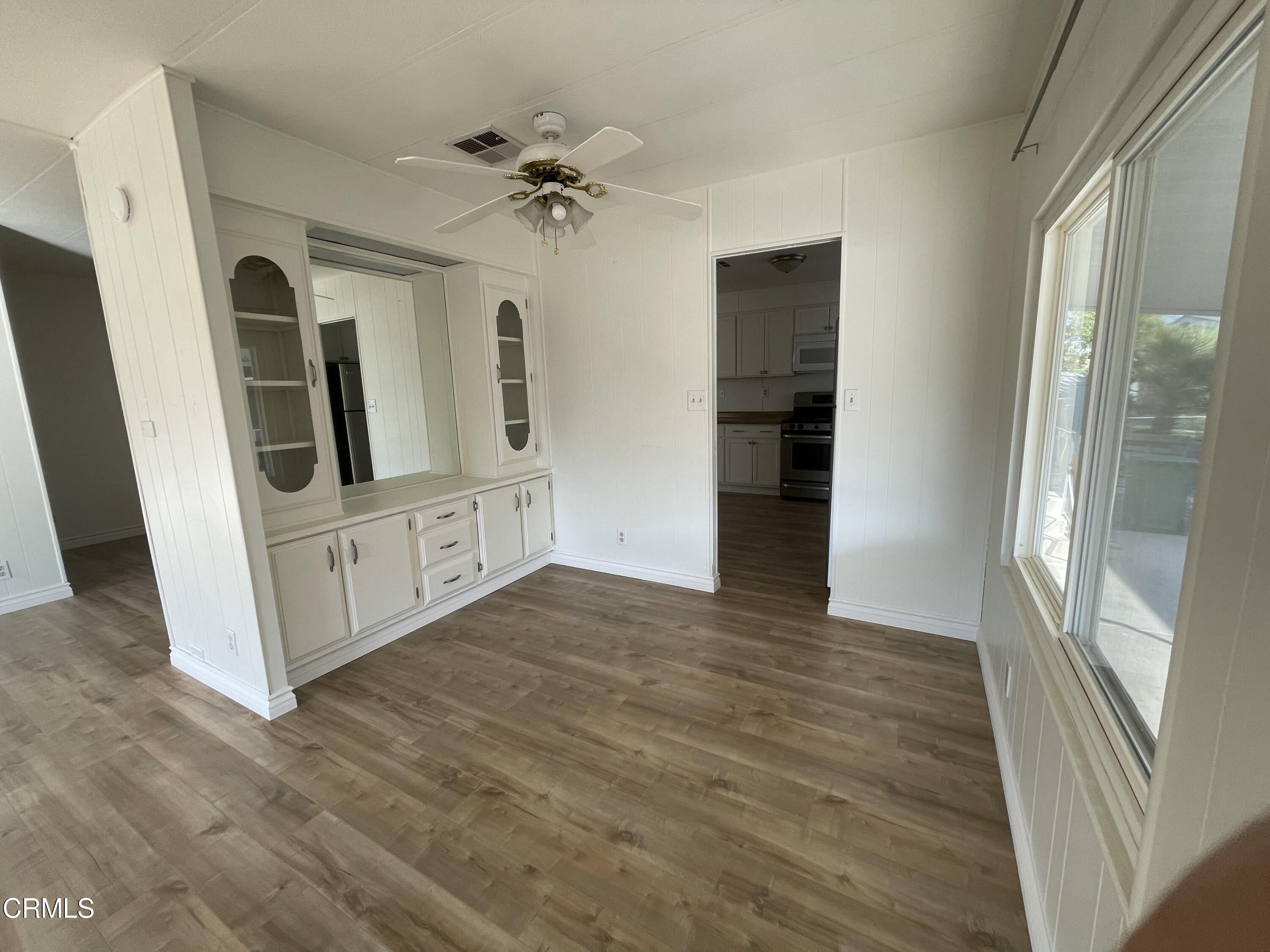 15750 Arroyo Drive, Unit 80 Moorpark, CA 93021 - Photo 7 of 19 a view of a hallway with wooden floor and staircase