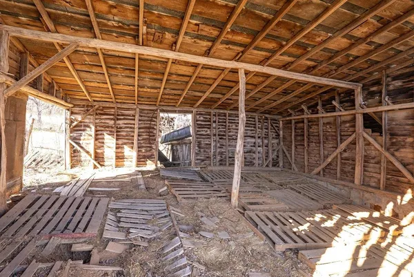 a view of a porch with wooden floor