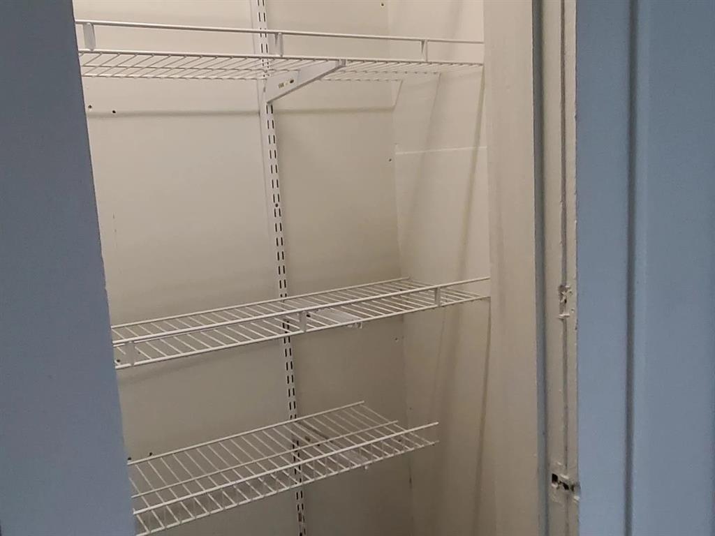 304 Fulton Street, Unit B Denton, TX 76201 - Photo 10 of 10 a view of a room with racks on the wall