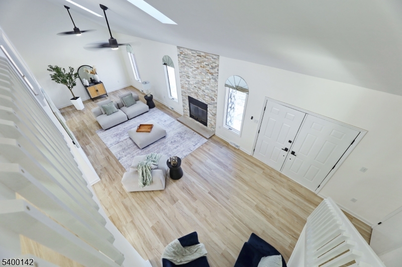 6 Maple Drive Vernon, NJ 07461 - Photo 19 of 47 a living room with furniture and a fireplace