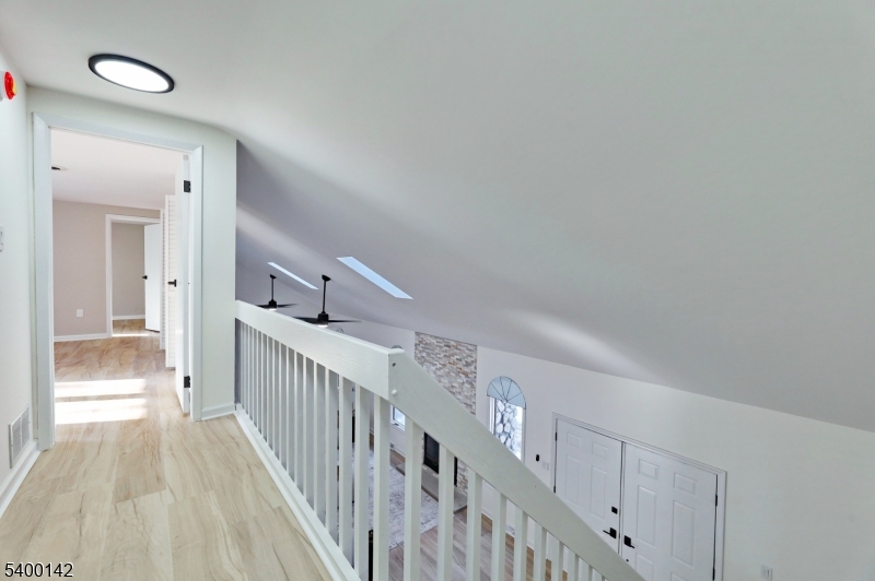6 Maple Drive Vernon, NJ 07461 - Photo 20 of 47 a view of a hallway with wooden floor