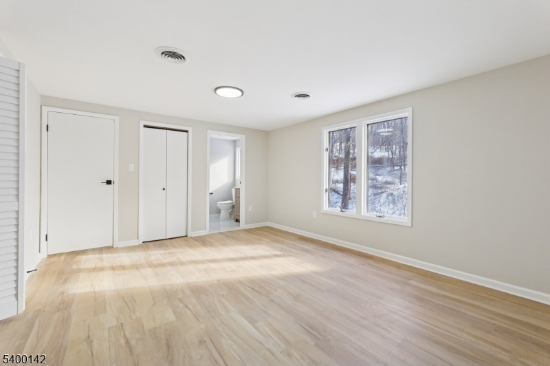 6 Maple Drive Vernon, NJ 07461 - Photo 26 of 47 a view of an empty room with wooden floor and a window