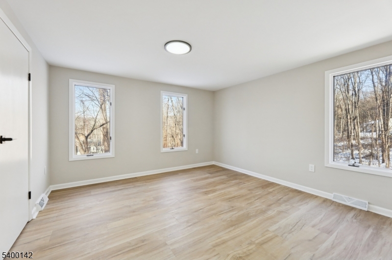 6 Maple Drive Vernon, NJ 07461 - Photo 27 of 47 a view of an empty room with wooden floor and window