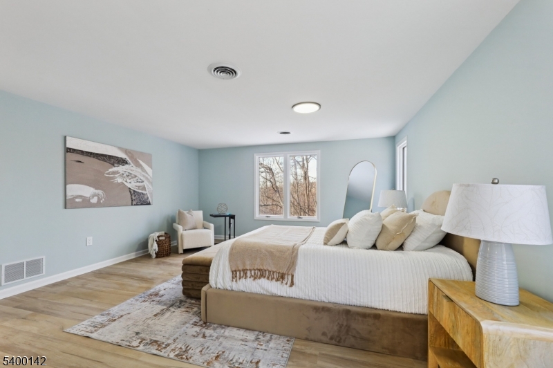 6 Maple Drive Vernon, NJ 07461 - Photo 33 of 47 a bedroom with a large bed and a window