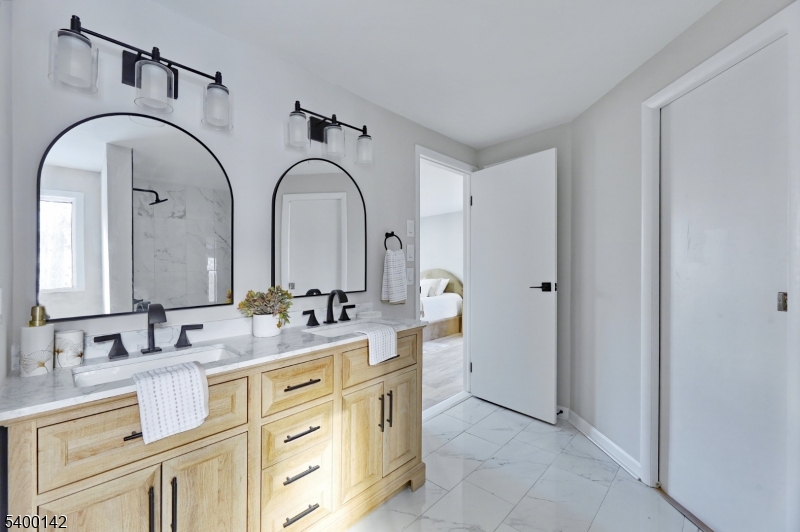 6 Maple Drive Vernon, NJ 07461 - Photo 35 of 47 a bathroom with a double vanity sink and a