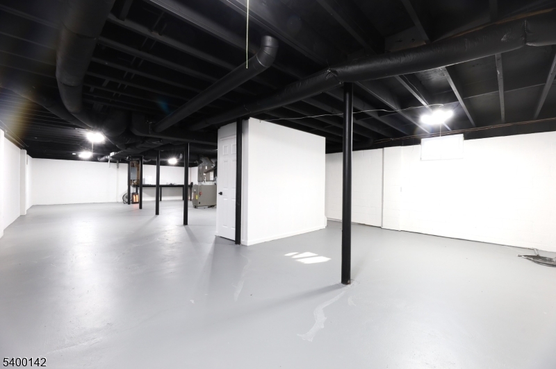 6 Maple Drive Vernon, NJ 07461 - Photo 39 of 47 a view of water heater room with wooden floor