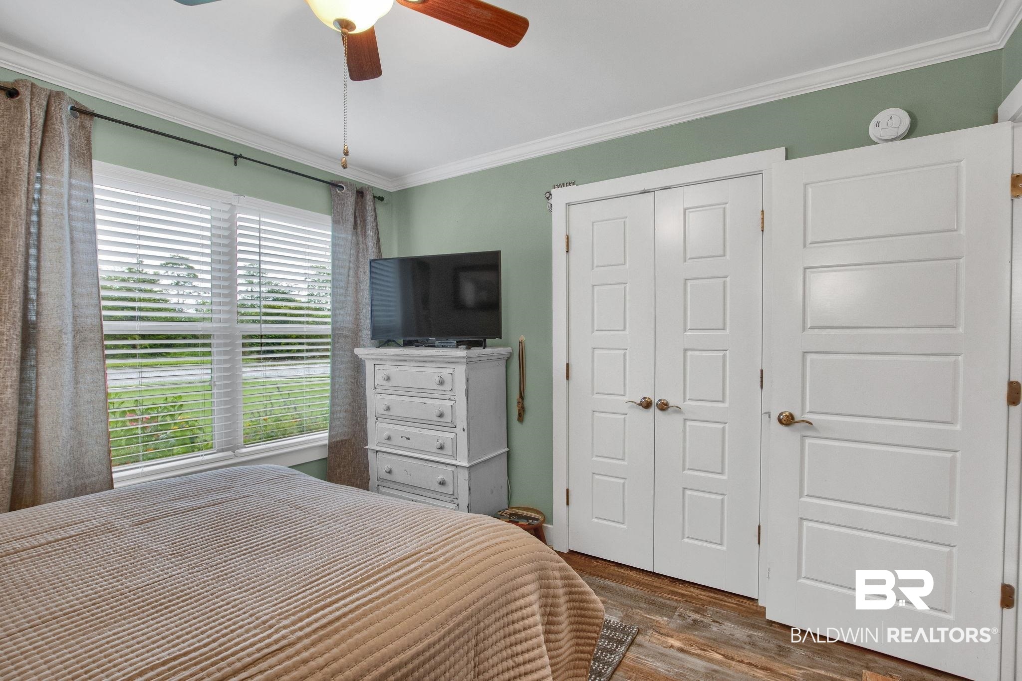 203 Lakefront Circle Summerdale, AL 36580 - Photo 47 of 69 Bedroom with multiple windows, ornamental molding, dark hardwood / wood-style floors, and ceiling fan