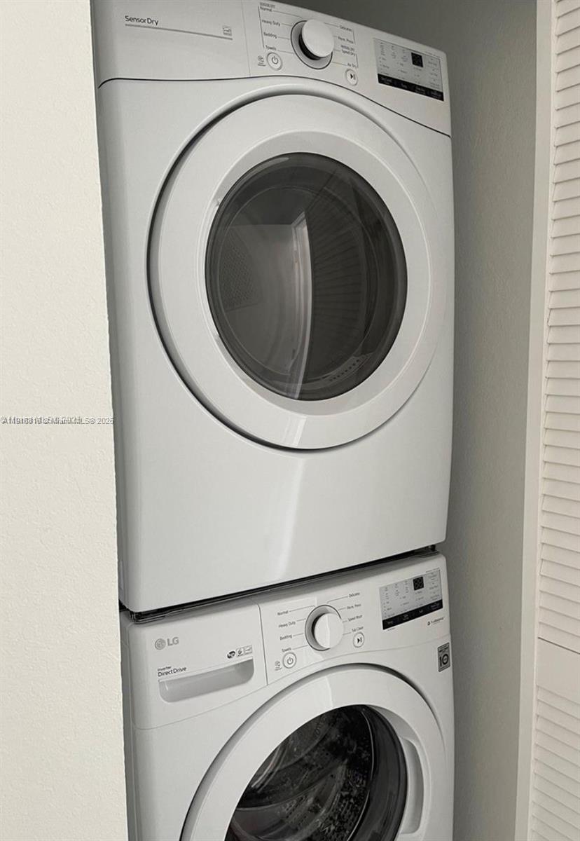 25842 Southwest 144th Avenue, Unit 25842 Homestead, FL 33032 - Photo 16 of 16 a utility room with dryer and washer