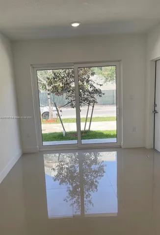 a bathroom with a toilet and shower