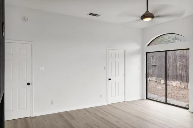 a bathroom with a shower and a glass door