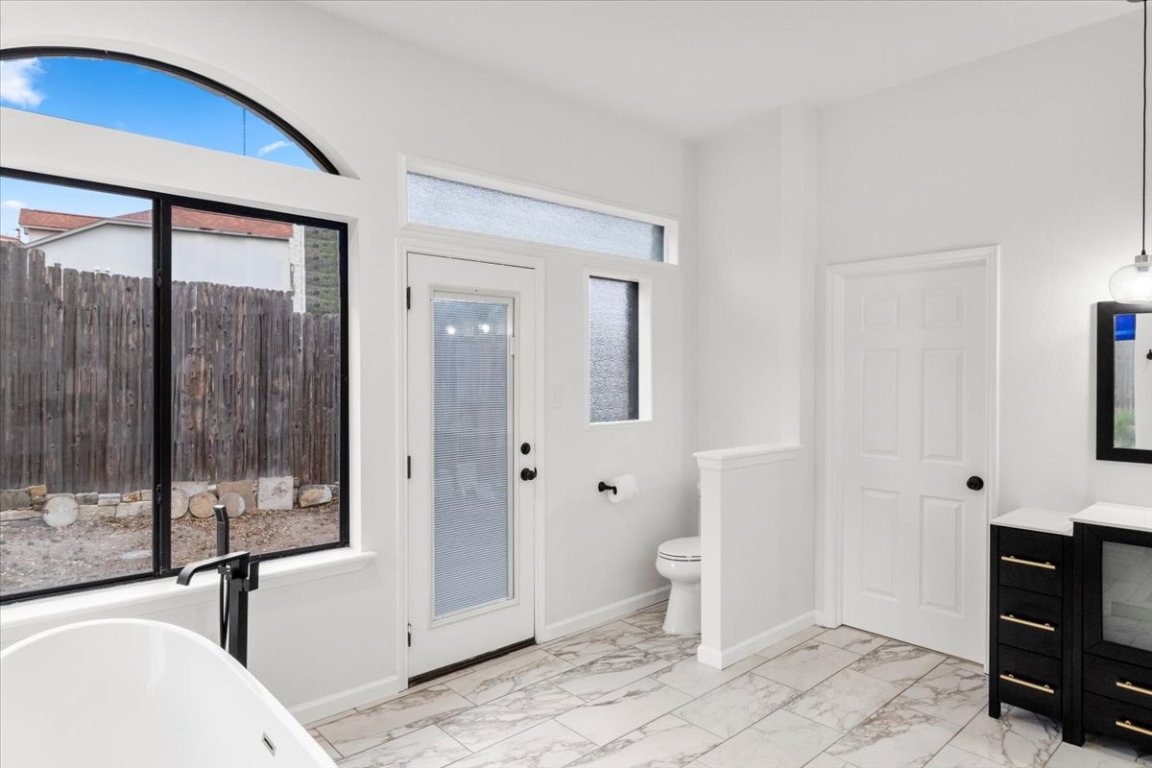 13816 Lakeview Drive Austin, TX 78732 - Photo 16 of 36 The ensuite bath hosts a free-standing soaking tub.