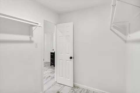 a bathroom with a shower and a glass door