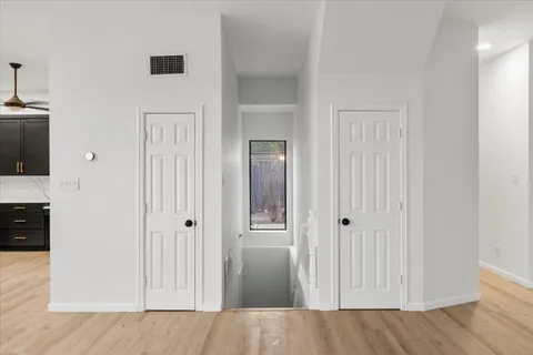 a view of a kitchen from the hallway
