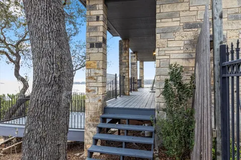 a view of a balcony with chairs