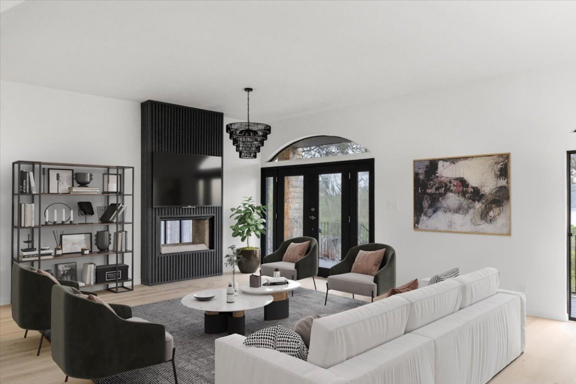 13816 Lakeview Drive Austin, TX 78732 - Photo 6 of 36 *Virtually staged* The living room is centered by a chic light fixture.