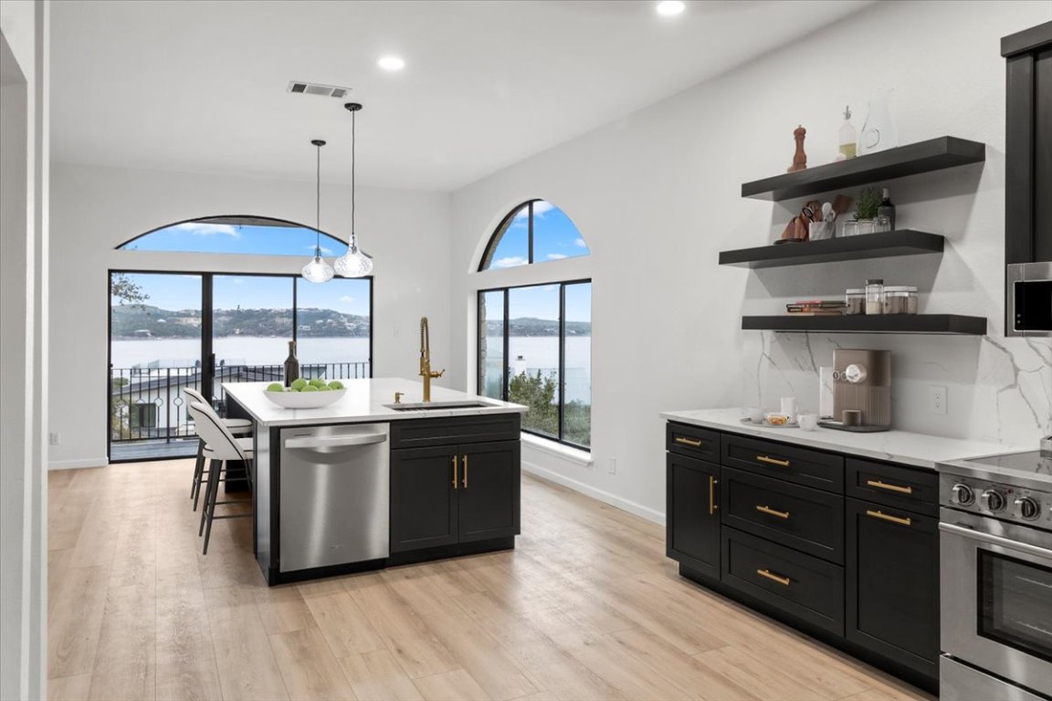 13816 Lakeview Drive Austin, TX 78732 - Photo 8 of 36 *Virtually Staged chairs/decor* Expansive windows and doors wrap the home.