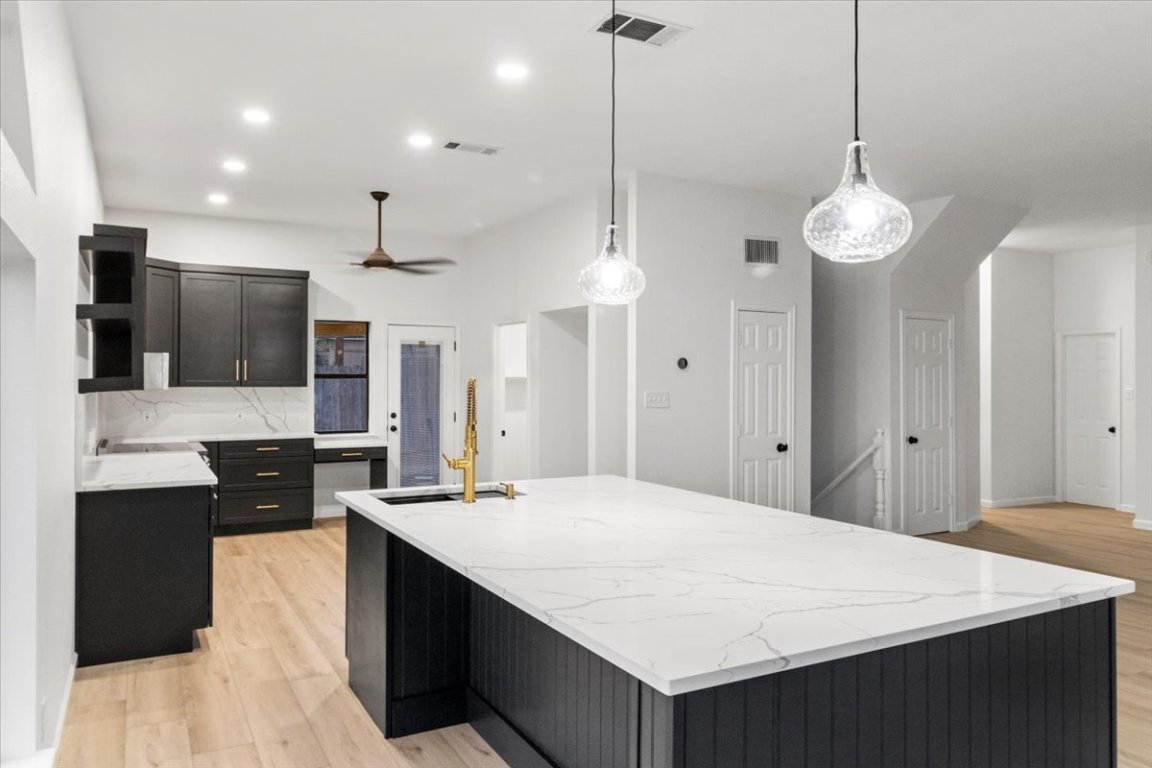 13816 Lakeview Drive Austin, TX 78732 - Photo 9 of 36 The expansive island overlooks the living room.