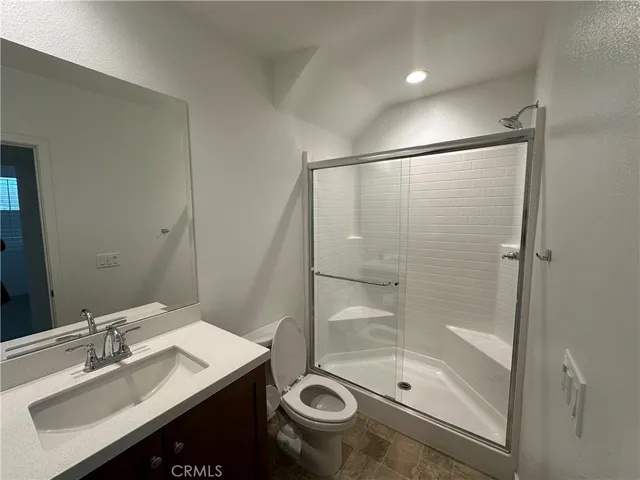 a bathroom with a sink toilet and mirror