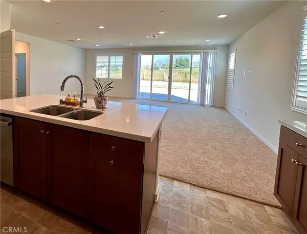 a kitchen with a sink and a window