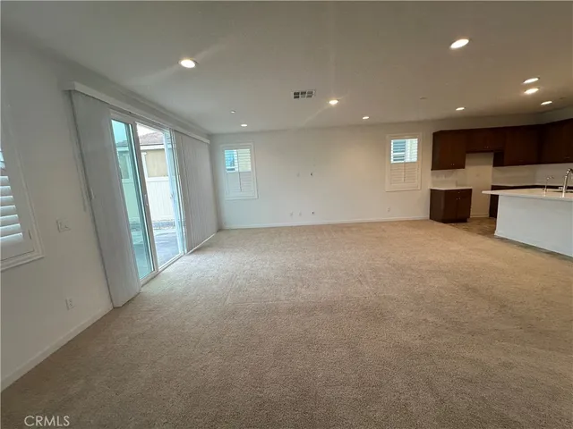 a kitchen with a sink a stove and cabinets
