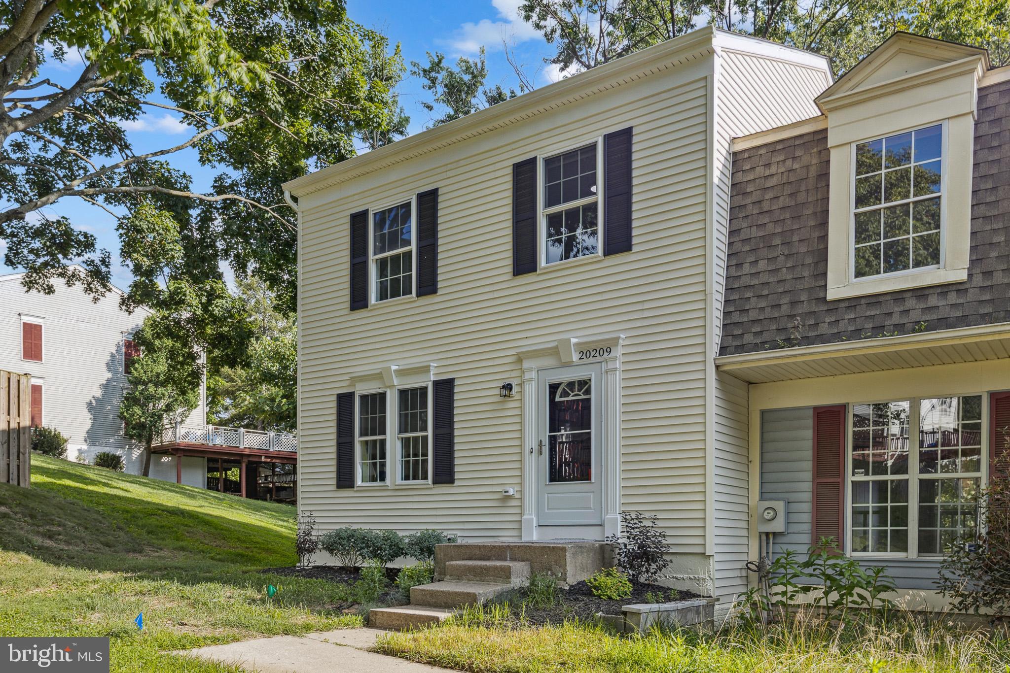 20209 Thunderhead Way Germantown, MD 20874 - Photo 1 of 26 a front view of a house with a yard