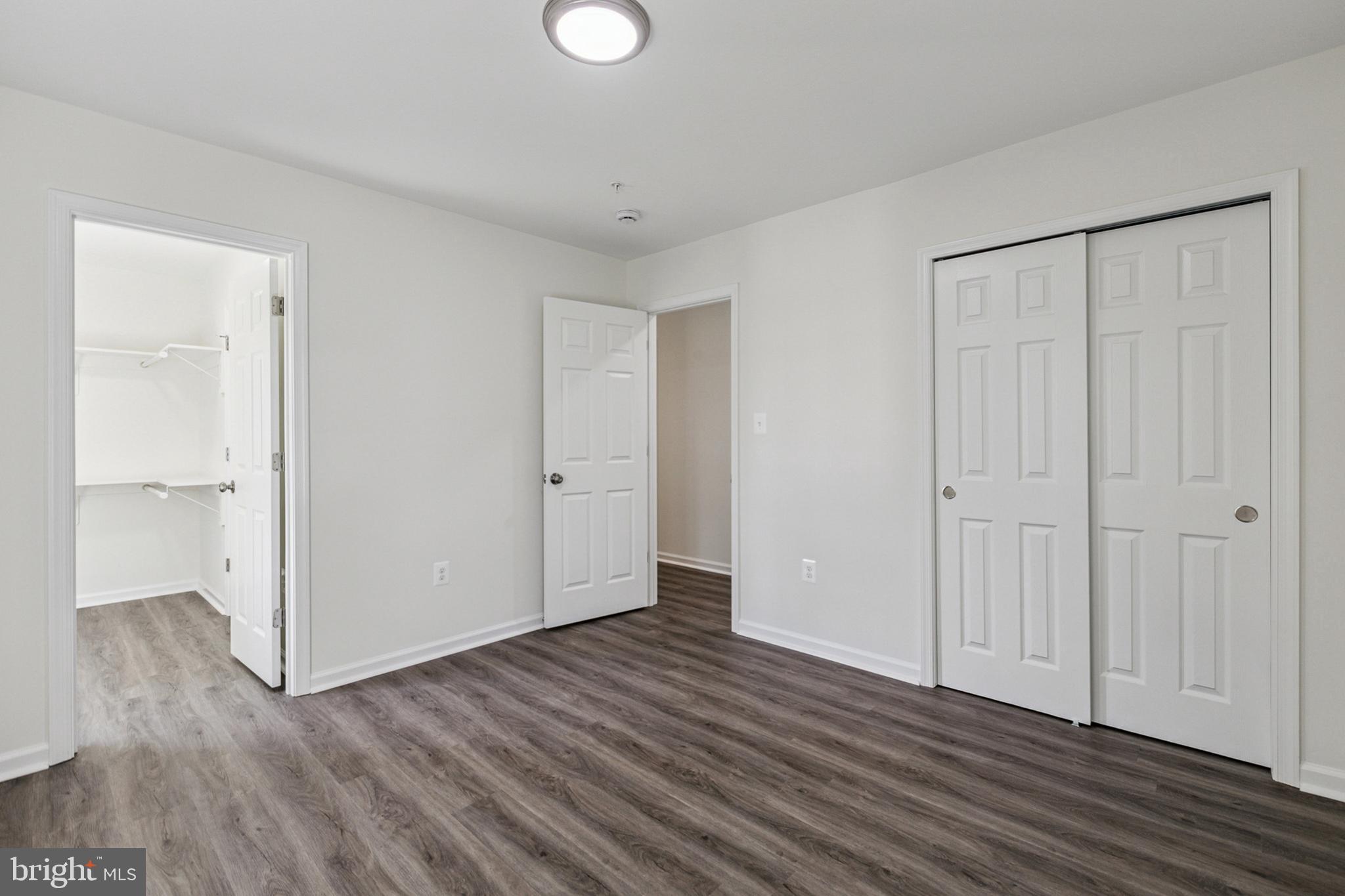 20209 Thunderhead Way Germantown, MD 20874 - Photo 15 of 26 a view of an empty room with wooden floor