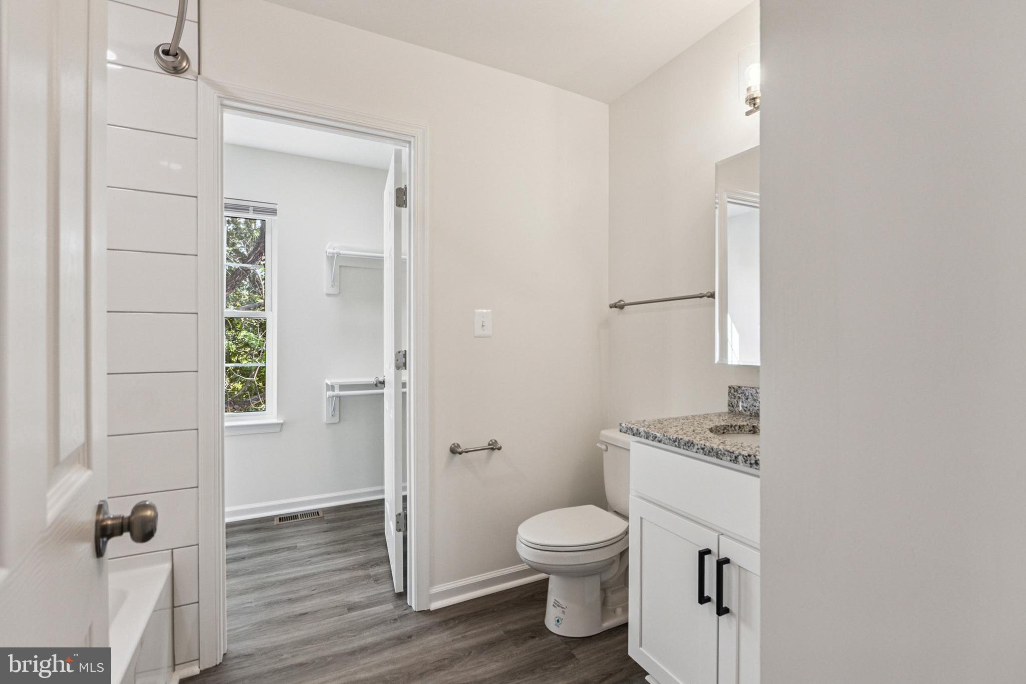 20209 Thunderhead Way Germantown, MD 20874 - Photo 19 of 26 a white toilet sitting next to a bathroom sink