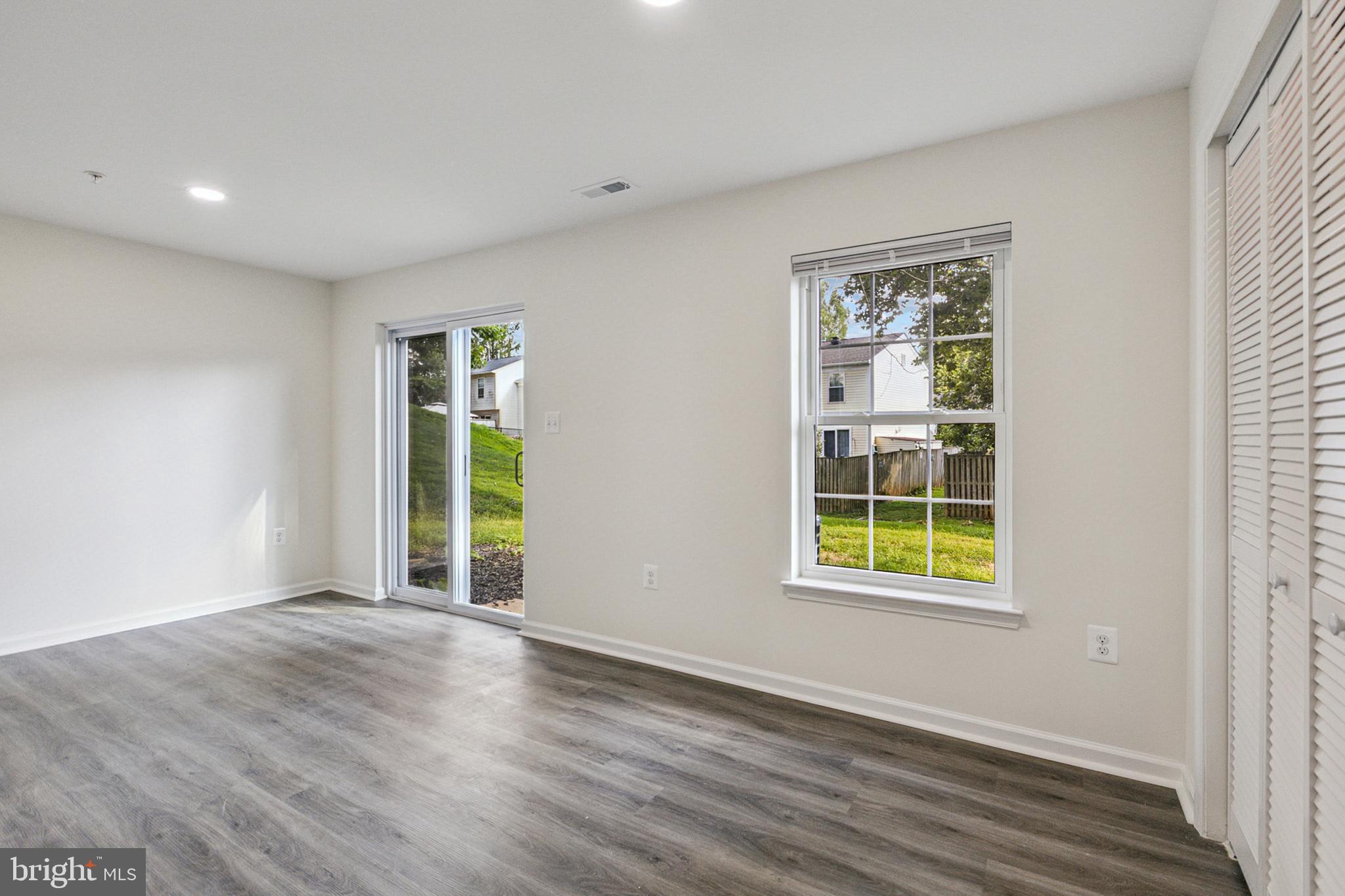 20209 Thunderhead Way Germantown, MD 20874 - Photo 20 of 26 an empty room with wooden floor and a window