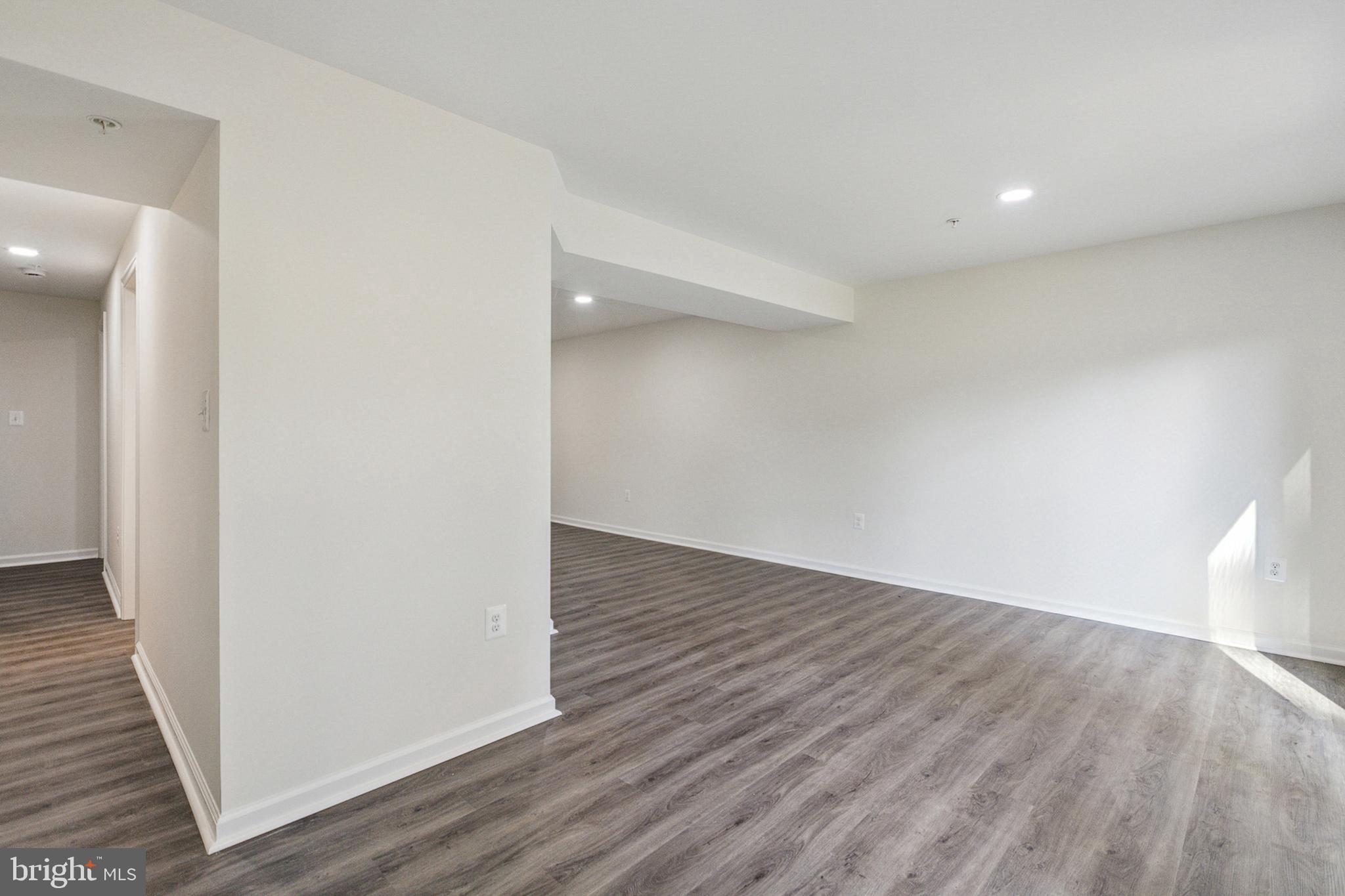 20209 Thunderhead Way Germantown, MD 20874 - Photo 21 of 26 a view of an empty room with wooden floor