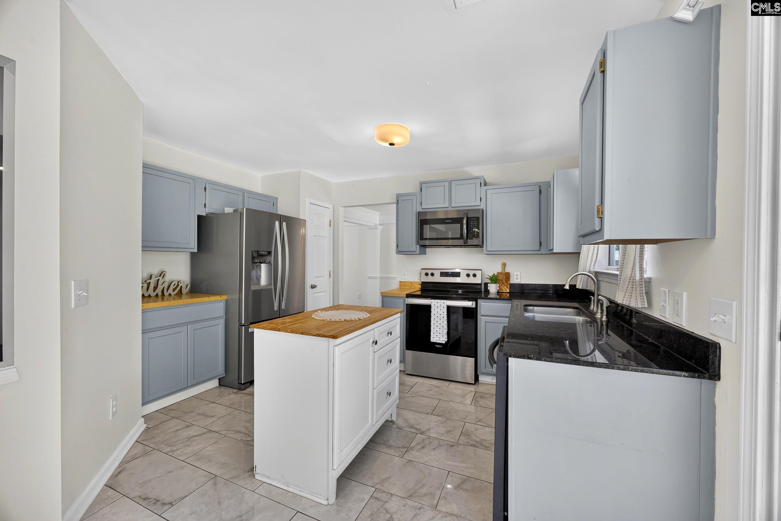 407 Sesqui Trail Columbia, SC 29223 - Photo 12 of 34 a kitchen with stainless steel appliances a refrigerator stove and sink
