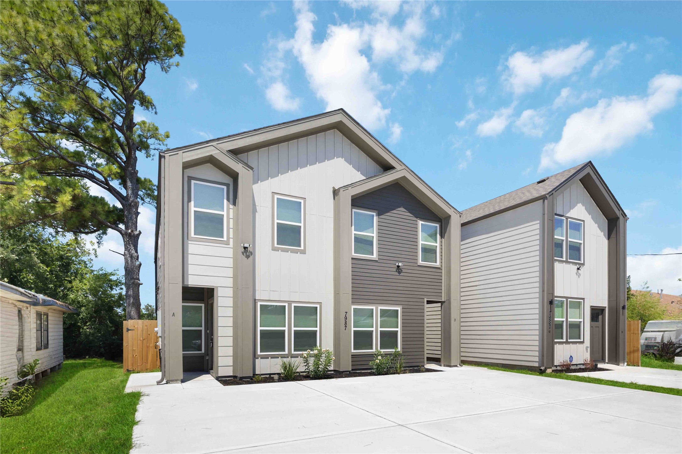 7987 Chateau Street, Unit A Houston, TX 77028 - Photo 1 of 24 a front view of a house with a garden