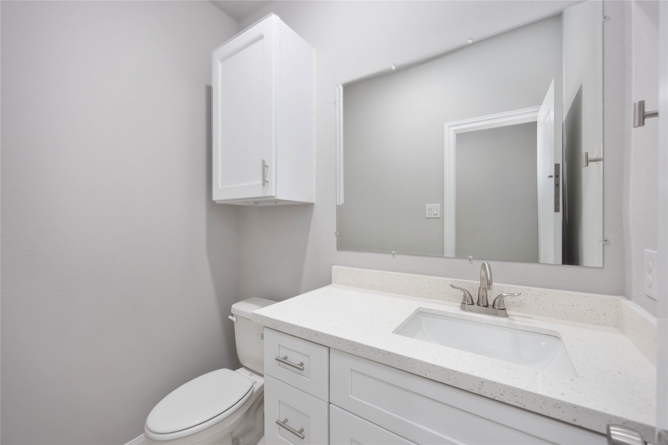 7987 Chateau Street, Unit A Houston, TX 77028 - Photo 12 of 24 a bathroom with a sink a toilet and vanity