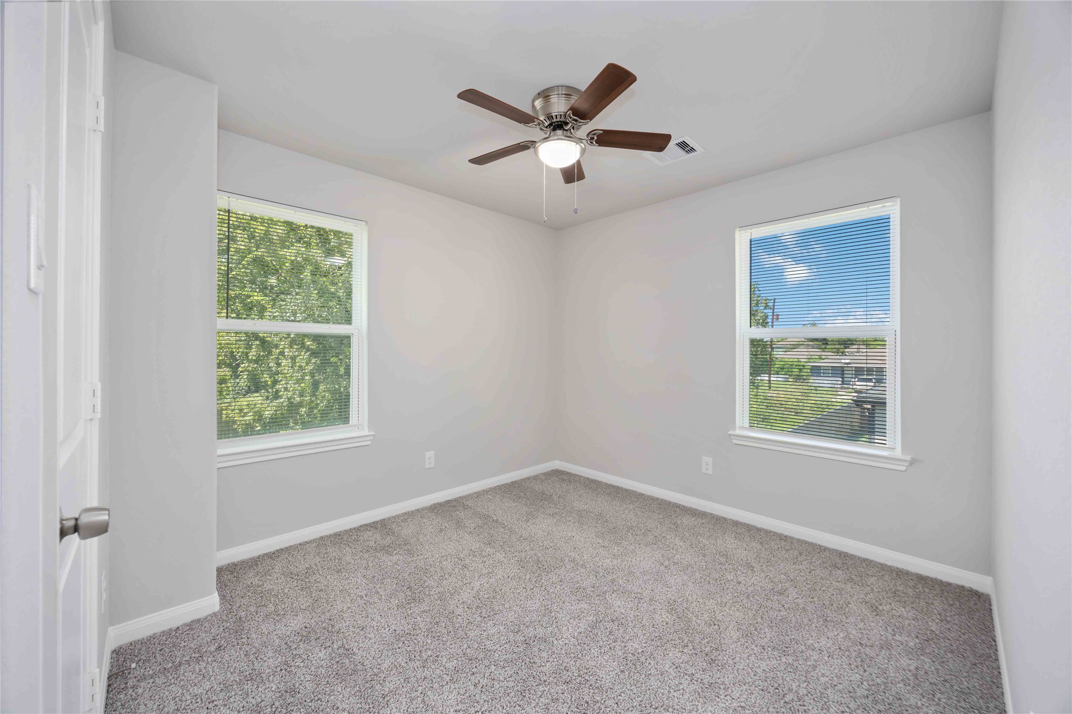 7987 Chateau Street, Unit A Houston, TX 77028 - Photo 20 of 24 a view of an empty room with wooden floor and a window