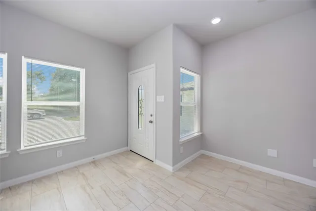 an empty room with windows