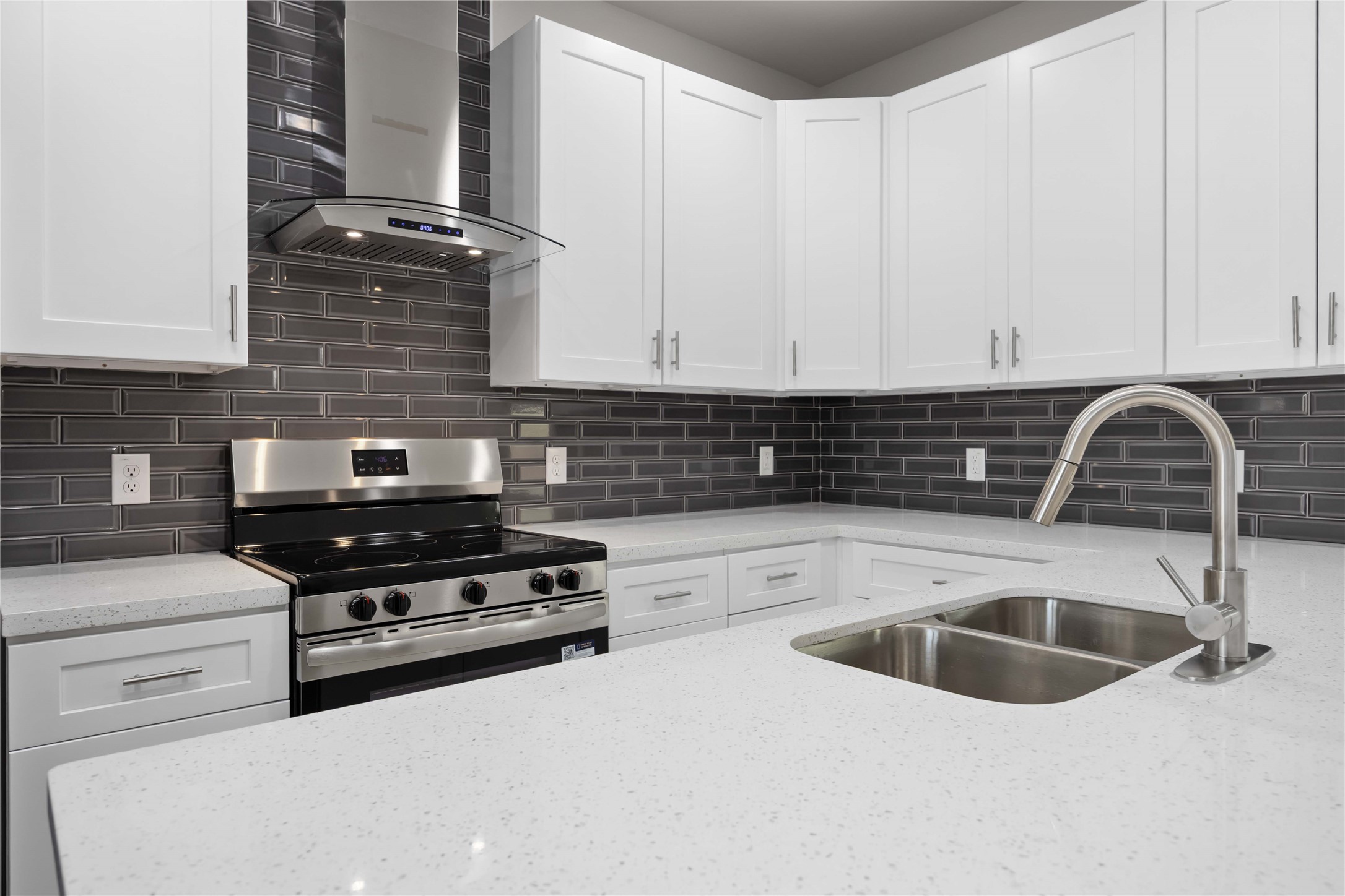 7987 Chateau Street, Unit A Houston, TX 77028 - Photo 10 of 24 a kitchen with granite countertop a sink a stove and cabinets