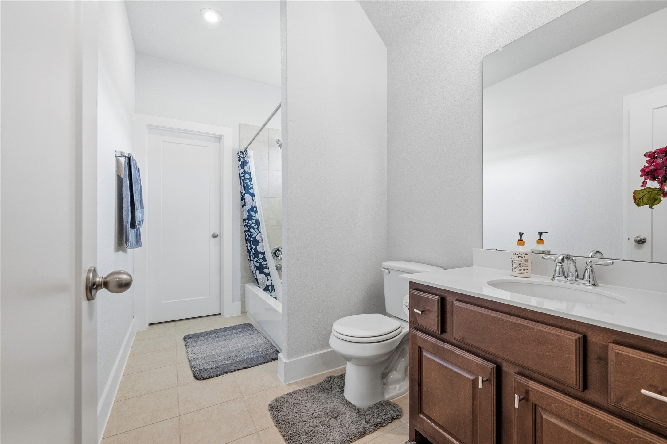 105 Autumn Oak Way Georgetown, TX 78628 - Photo 36 of 40 Bathroom featuring a single vanity with wood-finish cabinetry and a white countertop