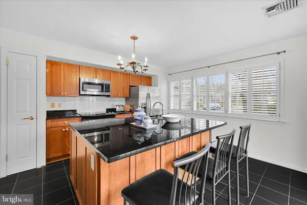 a kitchen that has a cabinets sink and stove