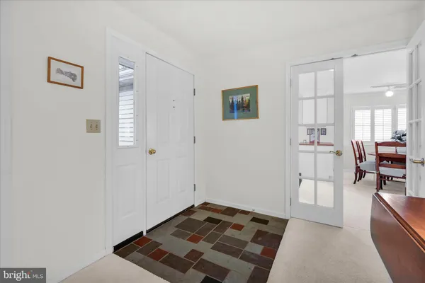 a bedroom with furniture and a book shelf