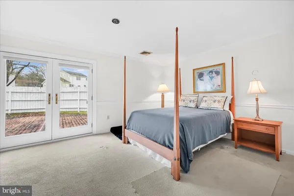 a bed room with a bed and a window