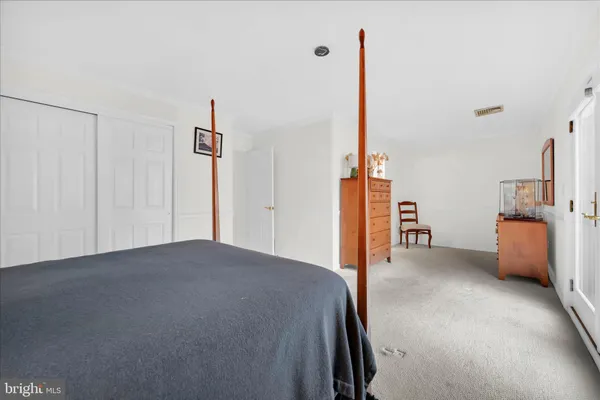 a living room with furniture and a ceiling fan