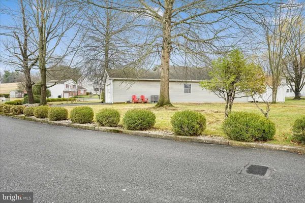 a view of a house with a yard and garage