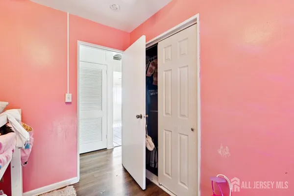 a bedroom with bunk bed and a window