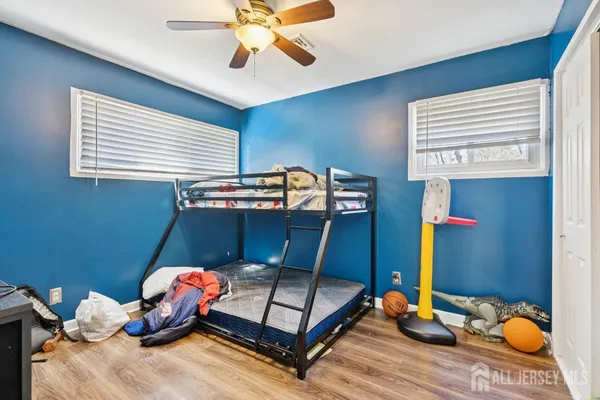 a bedroom with a bed furniture and decor