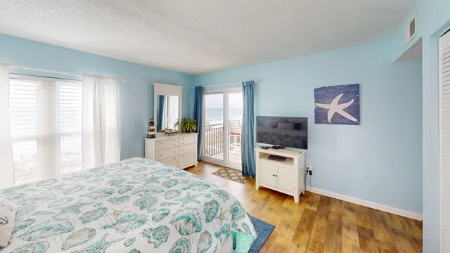 a bedroom with a bed and a dresser