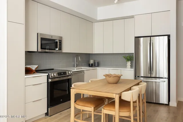 a kitchen with a stove and a refrigerator