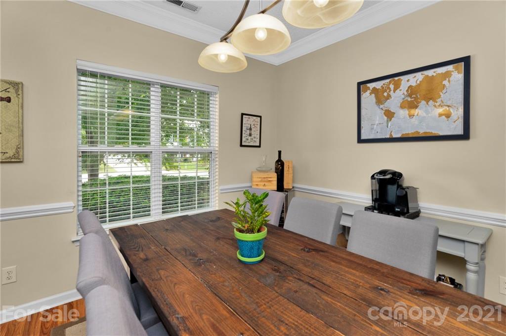 6925 Reedy Creek Road Charlotte, NC 28215 - Photo 2 of 34 a view of a dining room with a table and chairs