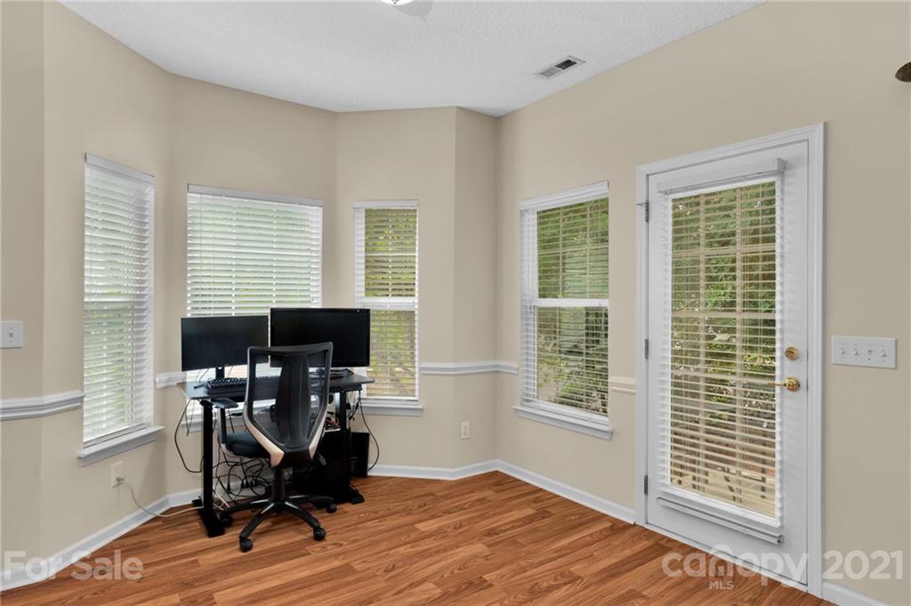 6925 Reedy Creek Road Charlotte, NC 28215 - Photo 12 of 34 a view of a workspace with furniture and a window