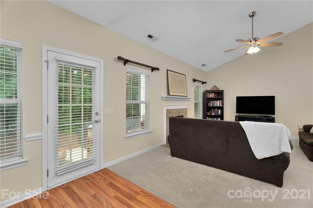 6925 Reedy Creek Road Charlotte, NC 28215 - Photo 13 of 34 a living room with furniture and a flat screen tv