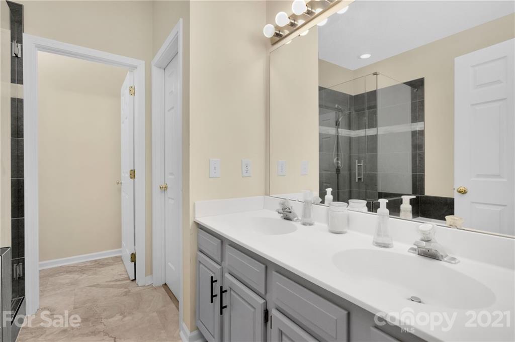 6925 Reedy Creek Road Charlotte, NC 28215 - Photo 21 of 34 a bathroom with a sink and a mirror