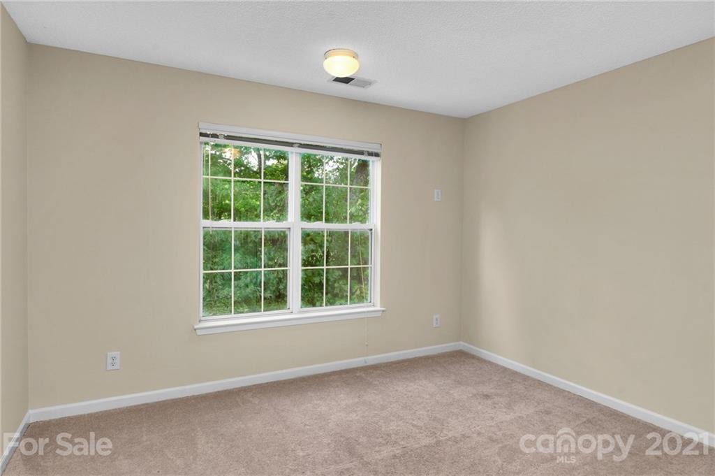 6925 Reedy Creek Road Charlotte, NC 28215 - Photo 25 of 34 an empty room with a window